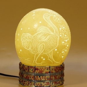 Carved Ostrich Egg, With a carved Ostrich Bird walking, Handmade bedside lampshade from South African Art Gifts. Beaded Stand Optional.