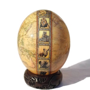 Weltkarte mit Big Five Tierköpfen auf Straußenei Shell Decoupage Art. Einzigartige afrikanische Wohnkultur-Geschenke, die weltweit versandt werden können.