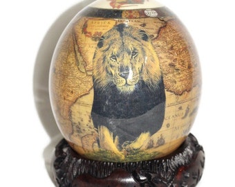 Ostrich Egg Decoupage Front facing Adult Lion King on a brown African Map Background. Comes with a Carved Wood stand. Art gift Ready to Ship