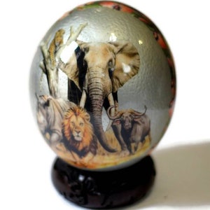 Ostrich egg shell Decoupage Big Five Animals on a Silver background. And an ebony wood Handcarved Stand with a fish eagle. Home Decor Art
