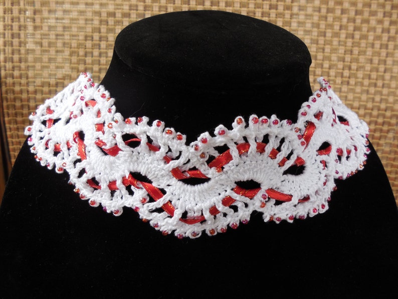 Victorian inspired white and red ribbon with opalescent red glass accent beads. Gothic Beautiful handmade crochet and beaded choker
