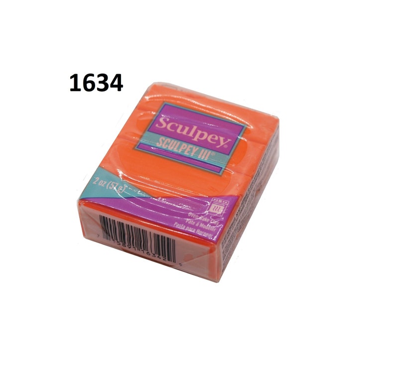 May include: A 2 ounce (57 gram) block of orange Sculpey III polymer clay. The packaging has the brand name Sculpey and the text "Sculpey III".