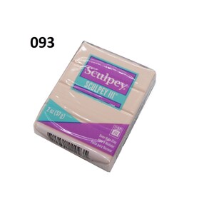 May include: A 2 ounce (57 gram) package of Sculpey III oven-bake clay. The package is pink and white with the Sculpey logo and the words "Oven-Bake Clay" and "Pasta para Hornear".