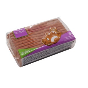 May include: A 1 pound (454 gram) block of Original Sculpey Oven-Bake Clay in a reddish-brown colour. The clay is packaged in a plastic wrapper with a purple and white label. The label features a cat illustration and the text "Original Sculpey Oven-Bake Clay Pâte à Modeler Pasta Para Hornear".
