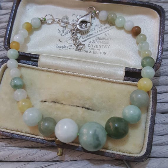 Bracciale in pietra di luna, rubini e perle, inserti in argento 925 su elastico