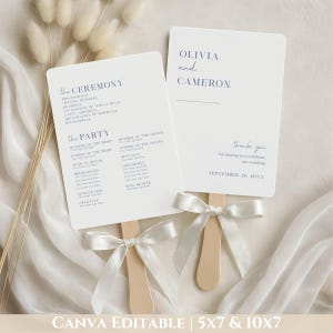 May include: Two white wedding fan programs with wooden handles and white ribbon bows. The programs have text in navy blue, including the names "Olivia and Cameron" and "thank you." The text "CANVA EDITABLE | 5X7 & 10X7" is at the bottom.