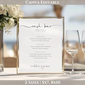 May include: A gold-framed cash bar menu with a white background. The menu lists beer, wine, and spirits with prices. The text "cash bar MENU" is at the top, with the names "madeline & jackson" at the bottom. Two sizes are listed: 5x7 and 8x10.