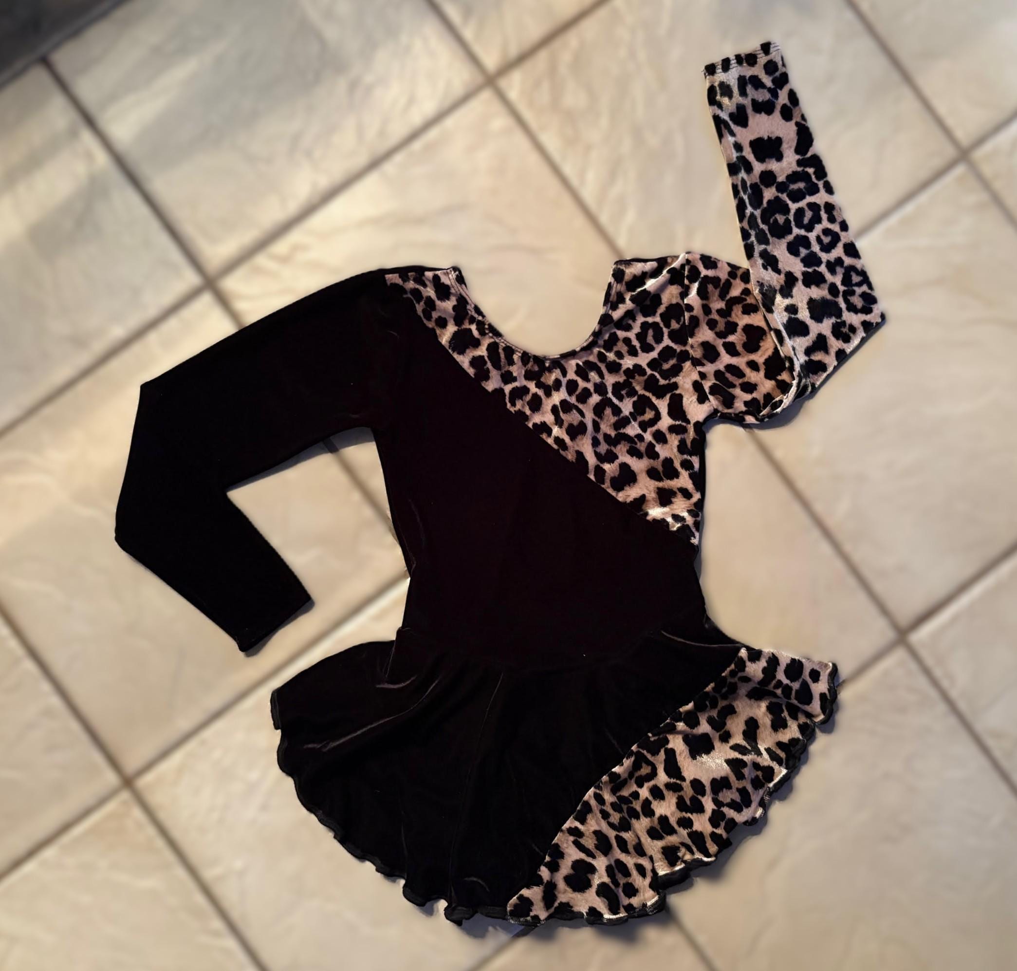 leopard print dress with black top underneath Where It All Begins Black Leopard Sleeve Sweater Dress – Shop the Mint main image 0