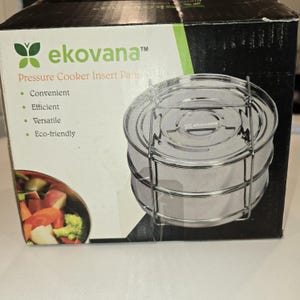 May include: A white ceramic mug with a black handle and the text "But First, Coffee" in a handwritten style. The mug is on a white surface. The mug is approximately 4 inches tall.