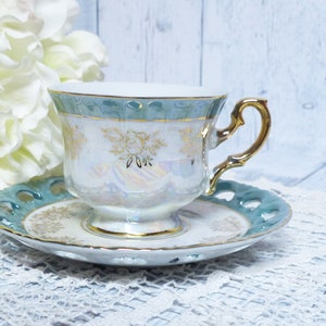 Vintage Empress by Haruta Porcelain Japan Teacup and Saucer Iridescent Cutout Design