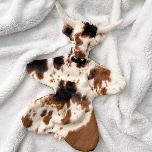 Tex the longhorn, lovie, stuffed animal, security blanket.