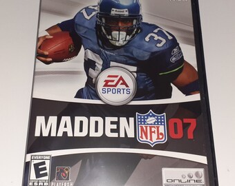 May include: A PlayStation 2 video game case for Madden NFL 07. The cover features a football player wearing a blue and green jersey with the number 37. The game is rated E for Everyone by the ESRB.