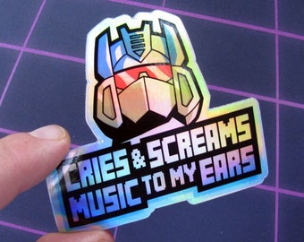May include: A holographic sticker featuring a cartoon robot head with the text "CRIES & SCREAMS MUSIC TO MY EARS".