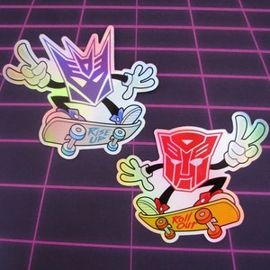Stickers HOLOGRAPHIQUES Insignia Transformers - Stickers métalliques découpés avec symbole Autobot Decepticon pour ordinateur portable, véhicule et plus encore !