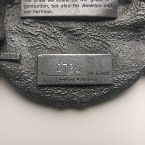 May include: A silver metal plaque with the text "1989 PROUD TO SERVE 1990" and "This year's theme, 'Proud to Serve' reminds all VFW members of not only the pride we share for our great organization, but also for America and our heritage."  The plaque also has the text "No. 2720 of 5,000 Limited Edition".