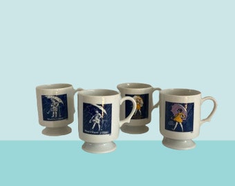 Morton Salt Commemorative Footed Mugs • "When It Rains, it Pours" • Complete Set of 4 Pedestal Mugs • 1914, 1921, 1956 & 1914 • 8 oz.