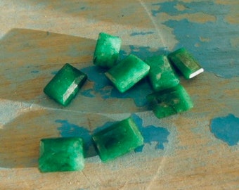 lot of emerald gemstones