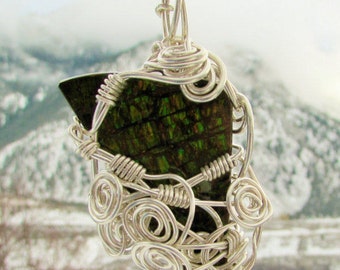 ammolite jewel pendant wrapped in sterling silver wire.