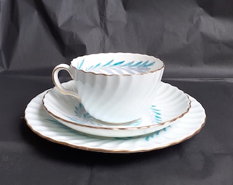 Vintage Minton 'Symphony' Ice Blue Fluted Swirled Tea Trio With Blue & Turquoise Leaf Pattern And Gilt Trims