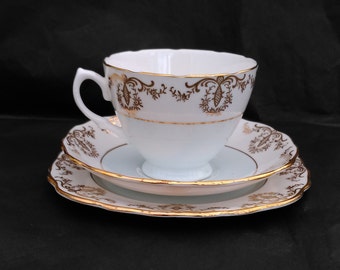 Royal Vale Baby Blue & White Harlequin Tea Trio (Teacup, Saucer, Plate) with Gold Filigree Detailing