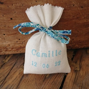 Customizable ivory linen dragees bag, aqua name, wiltshire blue crystal liberty cord