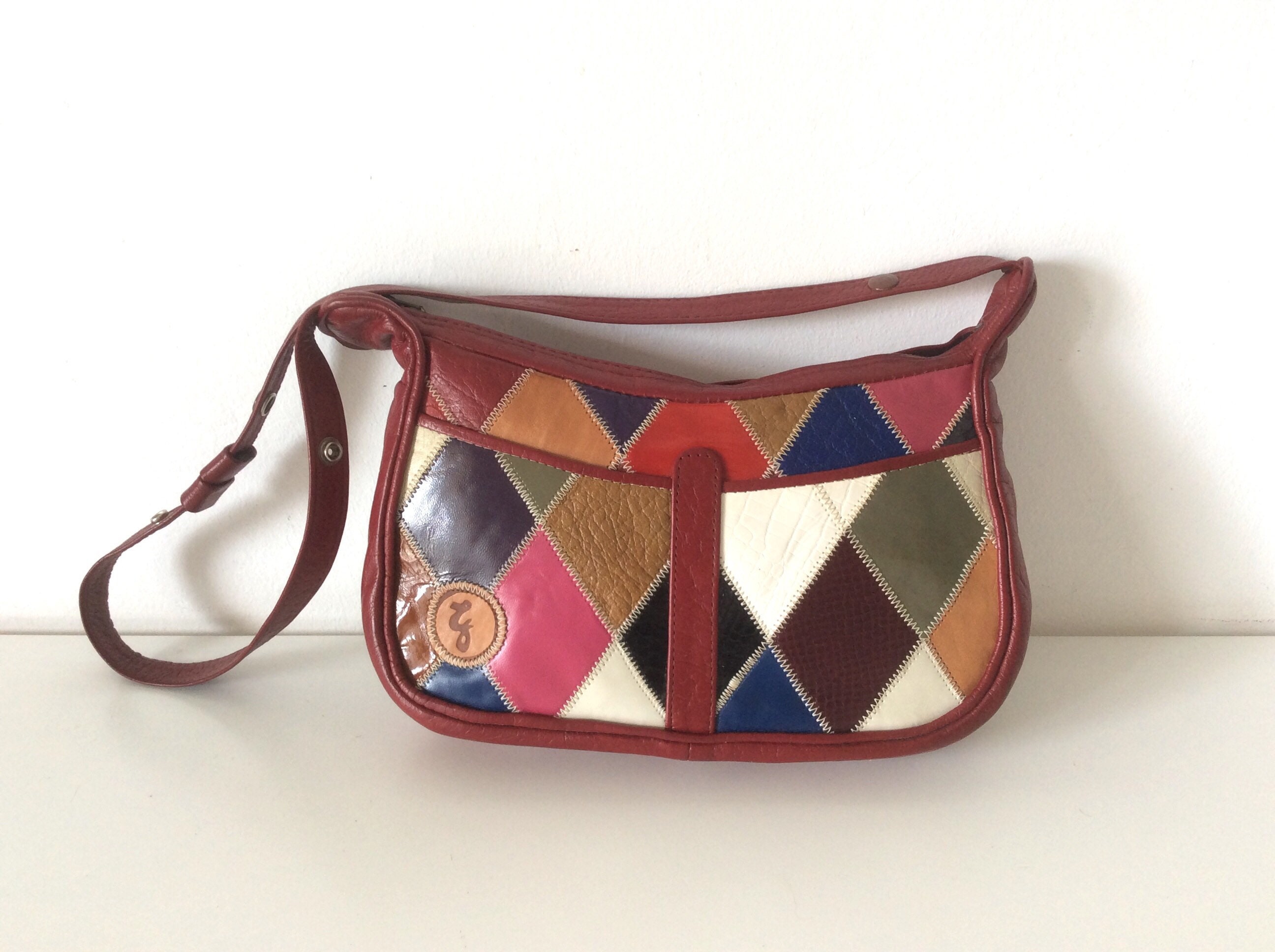 Designer Leather Puzzle Handbag Genuine Leather Curved Shoulder Bag With  Contrast Color, Patchwork Pattern, And Letter Detail From Posh66, $98.45 |  DHgate.Com