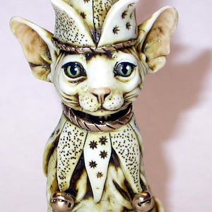 Artist Neil Eyre Eyredesigns Sphynx Cat Kitten Ivory color Gold Leaf accents Blue eyes Jester Bell Mardi Gras Fully Hand made USA Sculpture