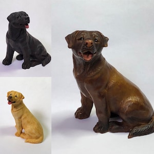 May include: Three Labrador Retriever dog figurines, one black, one brown, and one yellow. The figurines are all in a sitting position with their tongues sticking out.