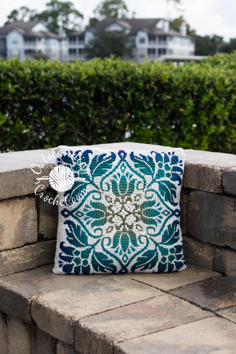 Petalique Pillows mosaic crochet pattern: smaller without a border and larger with a border. Made from the center without any tails to hide.  Features delicate flowers and leaves on the front with a plain back. Can be made as a wall hanging.