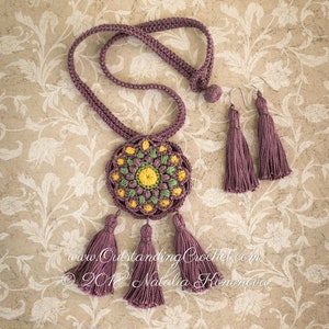 May include: A crocheted necklace with a round, multi-colored mandala pendant and tassel accents. Matching crocheted earrings with tassels are also included. The necklace and earrings are a deep purple color.