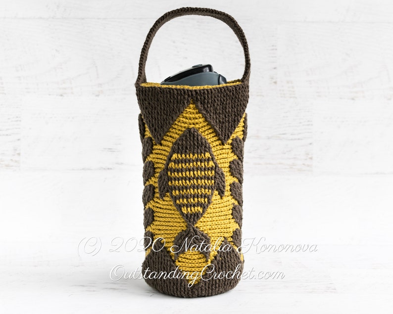 Crochet bag pattern: water bottle holder with a handle, made in embossed crochet technique,features a fish and branches.