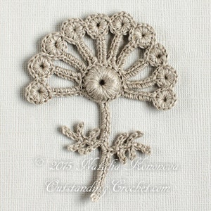 May include: A crocheted flower motif in beige with a stem and leaves. The flower has a central circle with a smaller circle in the centre. The flower is surrounded by a ring of smaller circles.