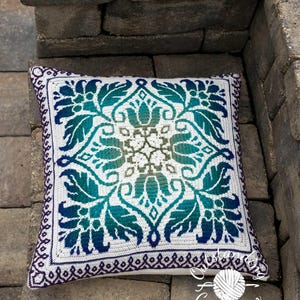 Petalique Pillows mosaic crochet pattern: smaller without a border and larger with a border. Made from the center without any tails to hide.  Features delicate flowers and leaves on the front with a plain back. Can be made as a wall hanging.