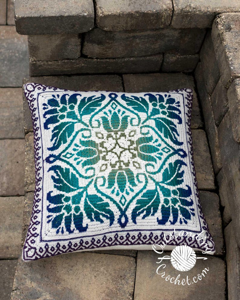 Petalique Pillows mosaic crochet pattern: smaller without a border and larger with a border. Made from the center without any tails to hide.  Features delicate flowers and leaves on the front with a plain back. Can be made as a wall hanging.