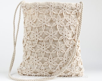 May include: A crocheted bag with a floral design and a beige rope strap. The bag is made of a light beige fabric and has a drawstring closure. The text "www.OutstandingCrochet.com © 2016 Natalia Rohonkova" is visible on the bag.