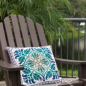 Petalique Pillows mosaic crochet pattern: smaller without a border and larger with a border. Made from the center without any tails to hide.  Features delicate flowers and leaves on the front with a plain back. Can be made as a wall hanging.
