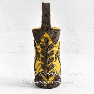 Crochet bag pattern: water bottle holder with a handle, made in embossed crochet technique,features a fish and branches.