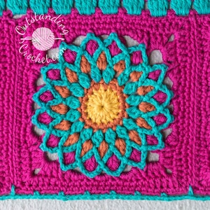 May include: Close-up of a crocheted square with a colorful flower design in the center. The flower is made with turquoise, orange, and yellow yarn. The square is made with pink yarn.