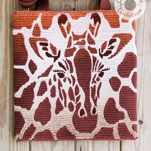 May include: A crocheted tote bag with a giraffe pattern in shades of brown and white. The bag has a ombre effect, with the brown color fading to white.