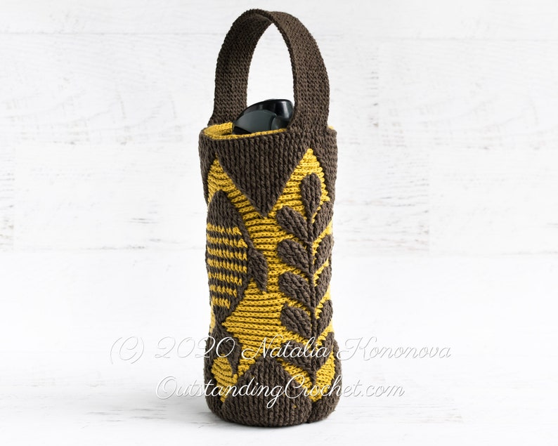 Crochet bag pattern: water bottle holder with a handle, made in embossed crochet technique,features a fish and branches.