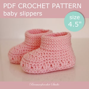 May include: A pair of pink crocheted baby slippers, size 4.5 inches. The slippers are made with a simple stitch pattern and have a soft, cosy feel.