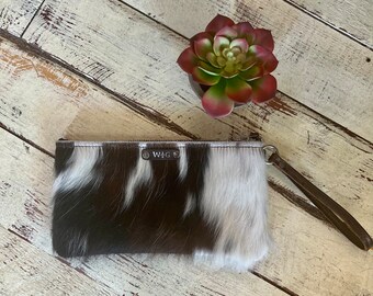 Tri color wristlet with embossed leather back!