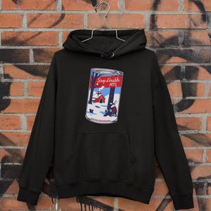 Schwarzer Unisex-Hoodie – Ahorn-Parodie | Illustration ©Gaga Hochet – Mit Kapuze und Kängurutasche | Entworfen und gedruckt in Montreal