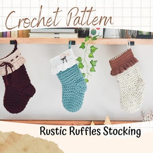 May include: Three crocheted Christmas stockings with ruffled tops hanging on a wooden shelf. The stockings are in burgundy, teal, and cream colors. The text "Rustic Ruffles Stocking" is below the stockings.