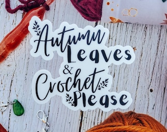 May include: White sticker with black text that reads "Autumn Leaves & Crochet Please" with a small leaf design on either side of the text.
