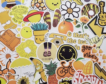 yellow hydroflask with stickers