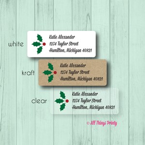 May include: Three rectangular address labels with a Christmas holly design. The labels are white, kraft, and clear, each with the name "Katie Alexander" and address details. The labels are for the city of Hamilton, Michigan.
