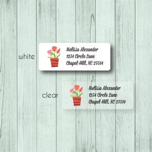 May include: Rectangular white and clear labels with a floral design. The labels feature a watercolor illustration of pink and orange tulips in a brown pot. The text on the labels reads "Melissa Alexander, 1234 Circle Lane, Chapel Hill, NC 27514."