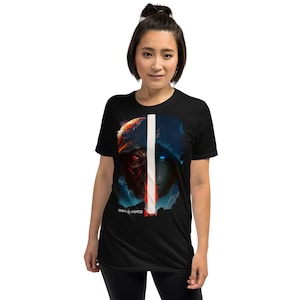 May include: Black t-shirt with a graphic of a hooded figure with red and blue eyes, split by a white line. The text "DARK vs FORCE" is printed below the graphic.