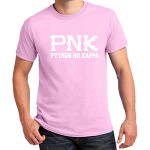 May include: A pink t-shirt with a white graphic that says "PNK" and "PYTHON NU KAPPA".